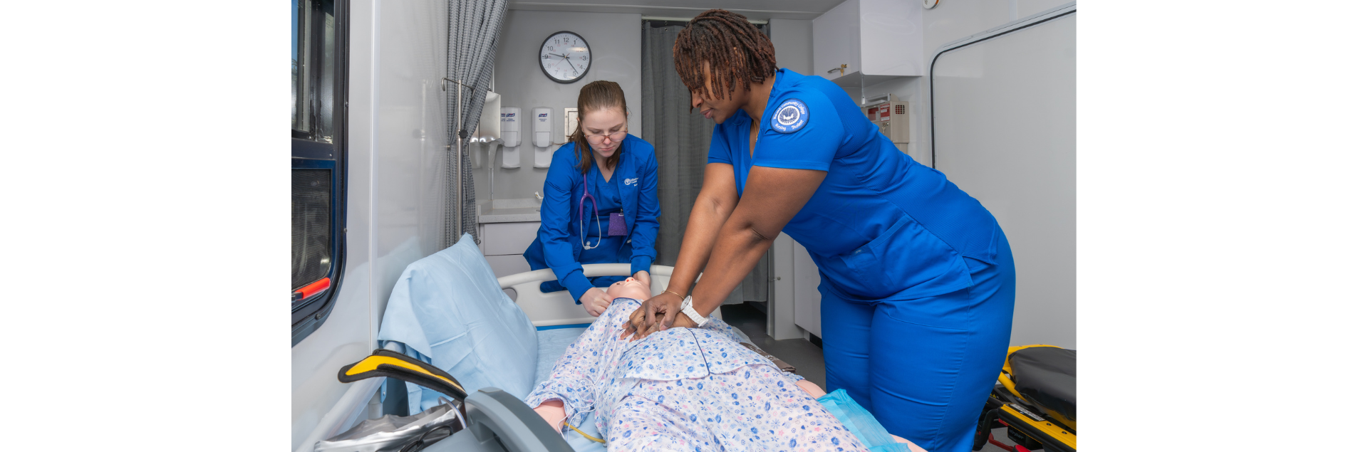 Nursing students Megan Harmon, 24, and Shera Golden, 37, both of Chesterfield, practice performing CPR on a human patient simulator inside Macomb Community College’s mobile simulation unit.