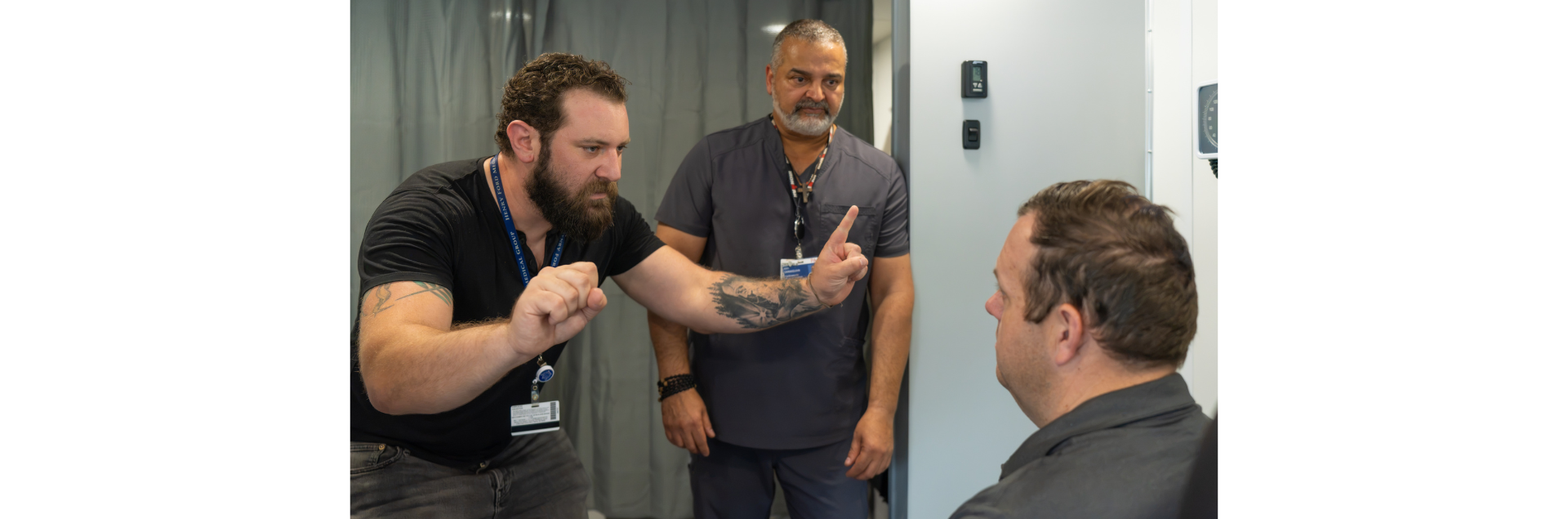 From left, Dr. Eric Goldstein, senior staff neurologist and stroke medical co-director, Henry Ford Macomb Hospital, and Ara Darakdjian, physician assistant, Henry Ford Macomb Hospital, participate in a stroke simulation as part of a hands-on clinical training exercise.