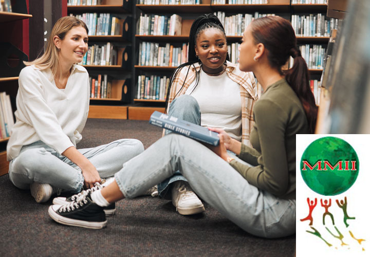 Students talking while sitting in the library