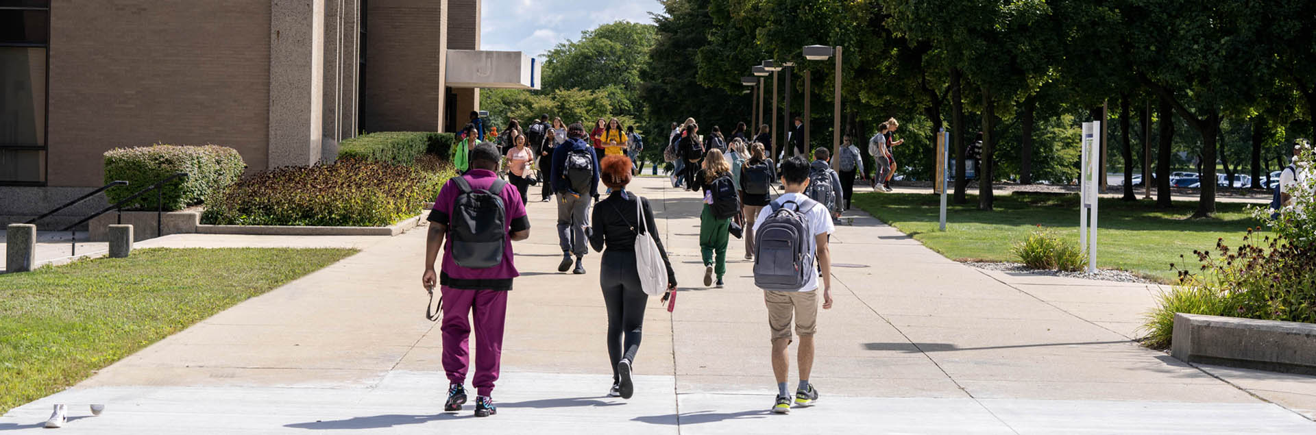 Macomb students walking on south campus by J building.