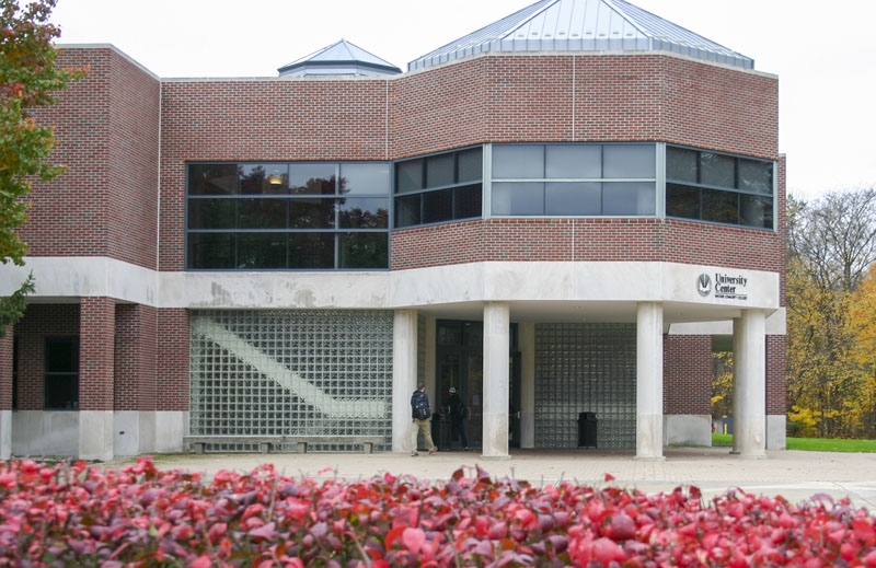 Macomb students talk outside of the University Center located on center campus.