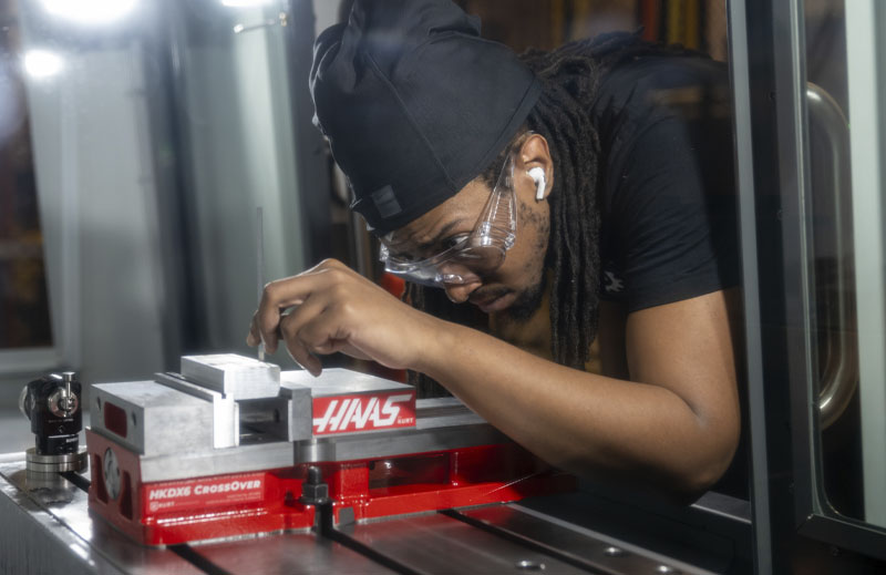 A Macomb student learns how to become a CNC machinist.