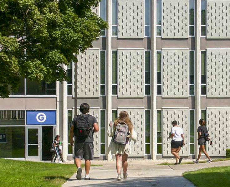 Students walking towards G Building on South Campus.
