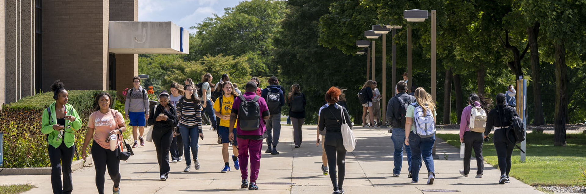 Macomb students walking on south campus by K building.