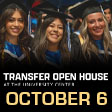 Three female students graduating and smiling at the camera